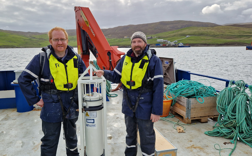 SAMS PhD student Gary Groves and Gregg Arthur of UHI Shetland prepare the IFCB for deployment